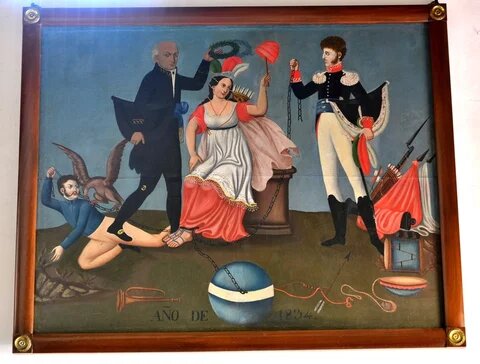 Alegoría de la Independencia en la que se aprecia cuatro personajes: uno en el piso, sujetando con su mano izquierda una cadena que pasa por su espalda, sobre la que posa un águila con las alas extendidas y la cabeza inclinada al piso; de pie junto a él, el cura Hidalgo sujeta en lo alto con su mano derecha una corona de olivo, al parecer para colocarla sobre la cabeza de una mujer, que probablemente representa a la Madre Patria, la cual se encuentra sentada sobre un basamento, con un tocado con tres plumas