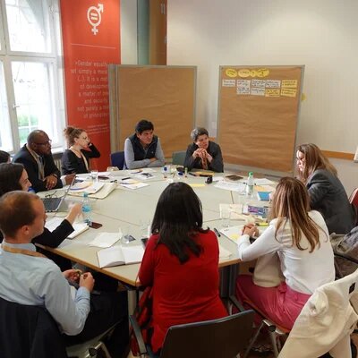Group of people seating on a round table